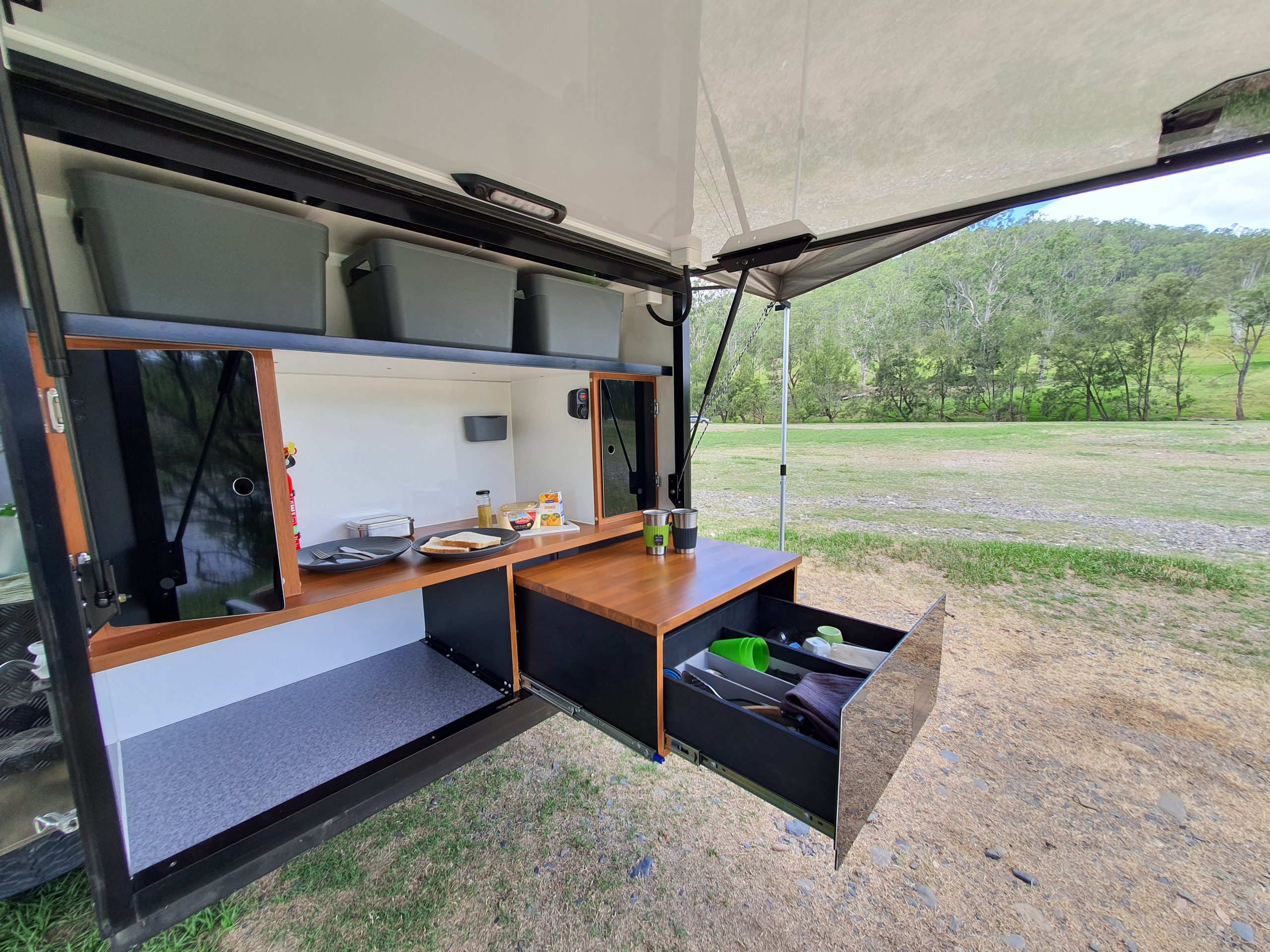 Check out the amount of storage in the Origin Campers Long-Range camper trailer . With abundant storage, easy access open shelving and large deep cupboards to store all your camping goodies.